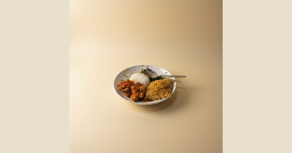 A plate of rice, fried chicken, and noodles.